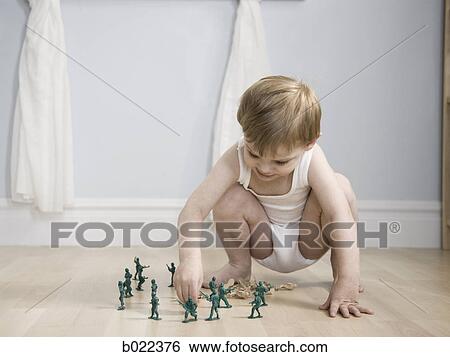 little boy playing with toy soldiers View Large Photo Image Stock Photograph - little boy playing with toy soldiers. Fotosearch