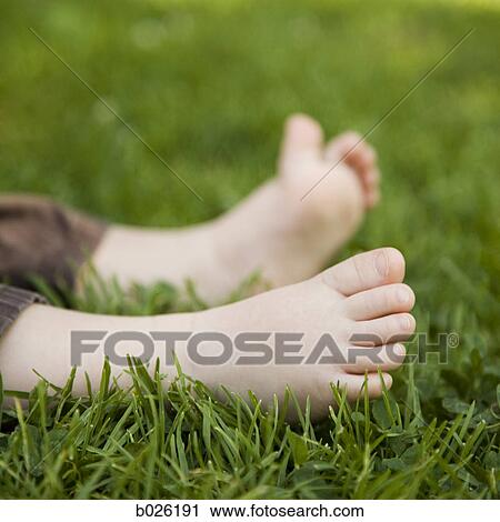 little feet on the grass View Large Photo Image Stock Image - little feet on the grass. Fotosearch