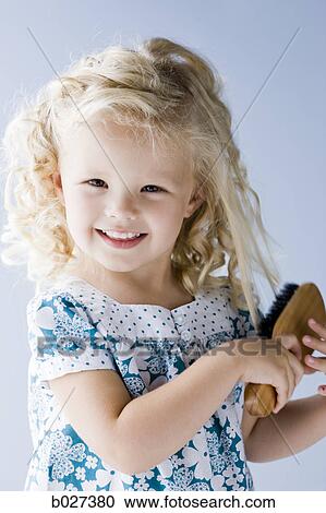 little girl brushing her hair View Large Photo Image Stock Image - little girl brushing her hair. Fotosearch