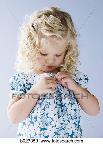 little girl buttoning her shirt View Large Photo Image Stock Photo - little girl buttoning her shirt. Fotosearch