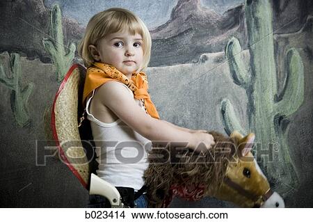 little girl dressing up as a cowgirl View Large Photo Image Picture - little girl dressing up as a cowgirl. Fotosearch