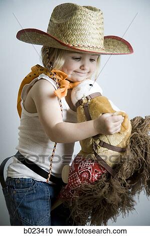 little girl dressing up as a cowgirl View Large Photo Image Stock Image - little girl dressing up as a cowgirl. Fotosearch