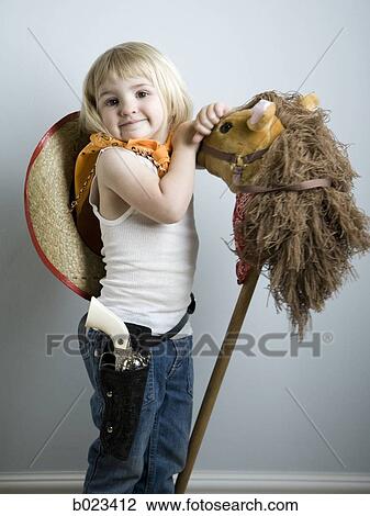 little girl dressing up as a cowgirl View Large Photo Image Stock Image - little girl dressing up as a cowgirl. Fotosearch