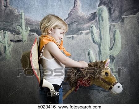 little girl dressing up as a cowgirl View Large Photo Image Stock Photograph - little girl dressing up as a cowgirl. Fotosearch