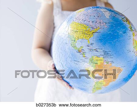 little girl holding a globe View Large Photo Image Stock Image - little girl holding a globe. Fotosearch