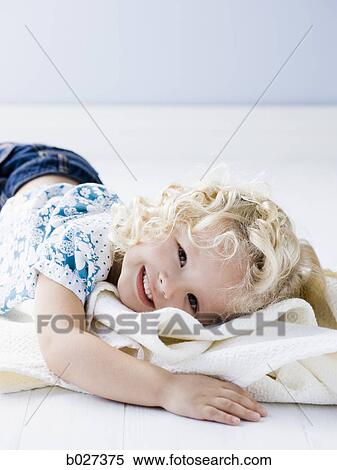 little girl holding her blanket View Large Photo Image Stock Photography - little girl holding her blanket. Fotosearch