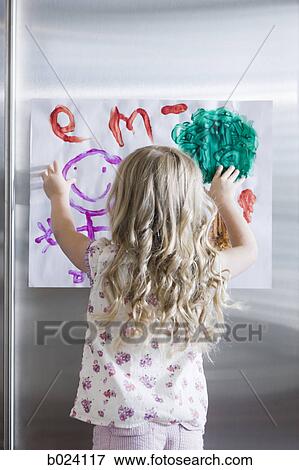 little girl holding up a drawing View Large Photo Image Stock Photo - little girl holding up a drawing. Fotosearch