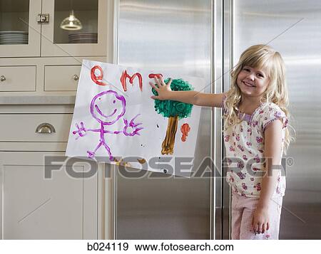 little girl holding up a drawing View Large Photo Image Stock Photo - little girl holding up a drawing. Fotosearch