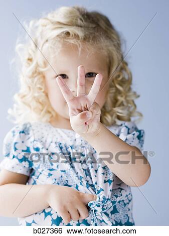 little girl holding up three fingers View Large Photo Image Stock Photograph - little girl holding up three fingers. Fotosearch