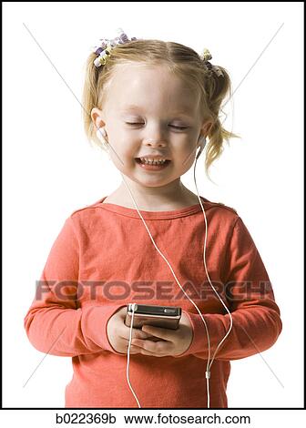 little girl listening to mp3 player View Large Photo Image Stock Image - little girl listening to mp3 player. Fotosearch