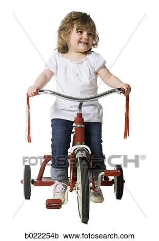 little girl on a tricycle View Large Photo Image Stock Image - little girl on a tricycle. Fotosearch