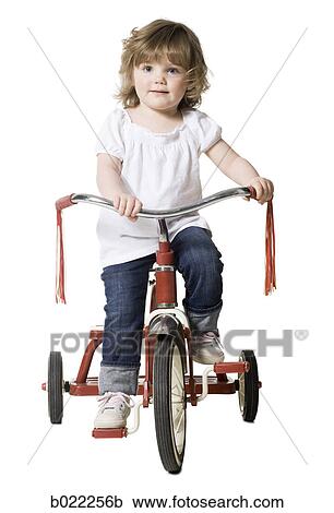 little girl on a tricycle View Large Photo Image Stock Image - little girl on a tricycle. Fotosearch