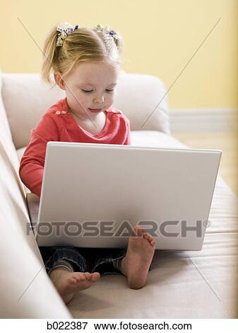 little girl using a laptop View Large Photo Image Stock Photo - little girl using a laptop. Fotosearch
