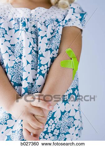 little girl with a bandaid on her arm View Large Photo Image Stock Image - little girl with a bandaid on her arm. Fotosearch