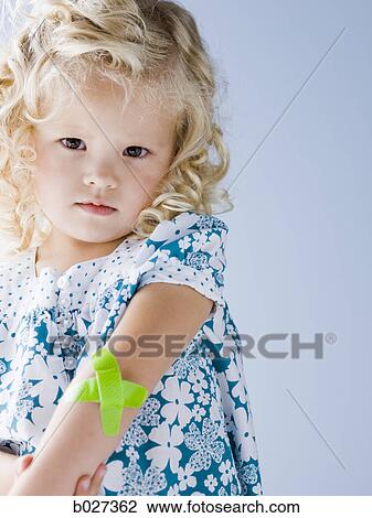 little girl with a bandaid on her arm View Large Photo Image Stock Image - little girl with a bandaid on her arm. Fotosearch