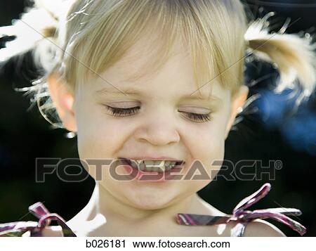 Stock Image - little girl with pigtails. Fotosearch