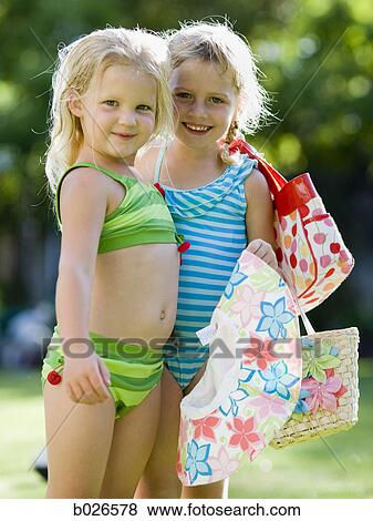 Stock Photo - little girls in their swimsuits. Fotosearch