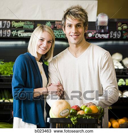 man and woman at the supermarket View Large Photo Image Stock Image - man and woman at the supermarket. Fotosearch