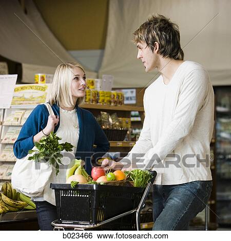 man and woman at the supermarket View Large Photo Image Stock Photograph - man and woman at the supermarket. Fotosearch