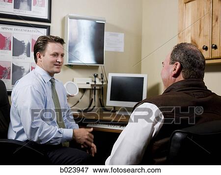 man at chiropractor's office View Large Photo Image Stock Photo - man at chiropractor's office. Fotosearch