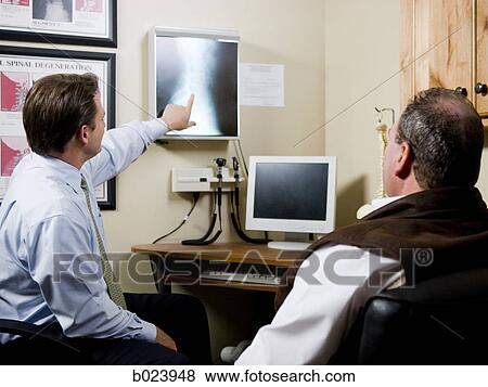 man at chiropractor's office View Large Photo Image Stock Photo - man at chiropractor's office. Fotosearch