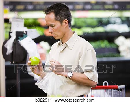 man at the grocery store View Large Photo Image Stock Image - man at the grocery store. Fotosearch