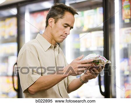 Stock Photography - man at the grocery store. Fotosearch