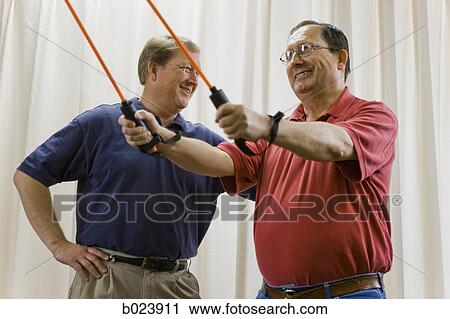 man doing physical therapy View Large Photo Image Stock Image - man doing physical therapy. Fotosearch