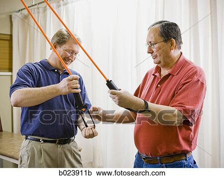 man doing physical therapy View Large Photo Image Stock Image - man doing physical therapy. Fotosearch