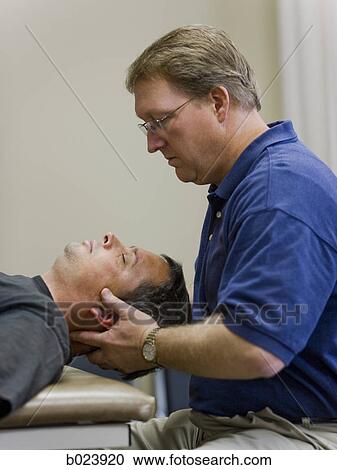 Stock Image - man doing physical therapy. Fotosearch