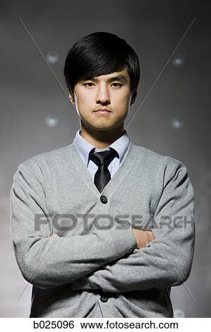 Man dressed in business casual with a serious face View Large Photo Image Stock Photograph - Man dressed in business casual with a serious face. Fotosearch