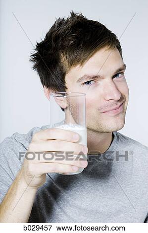 man drinking a glass of milk View Large Photo Image Stock Photo - man drinking a glass of milk. Fotosearch