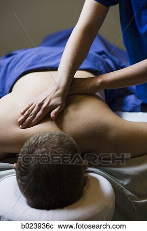 Stock Image - man getting a massage. Fotosearch