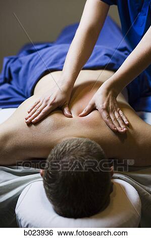 man getting a massage View Large Photo Image Stock Photograph - man getting a massage. Fotosearch