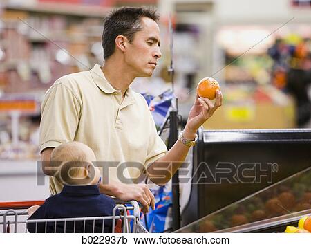 man grocery shopping with baby View Large Photo Image Stock Image - man grocery shopping with baby. Fotosearch