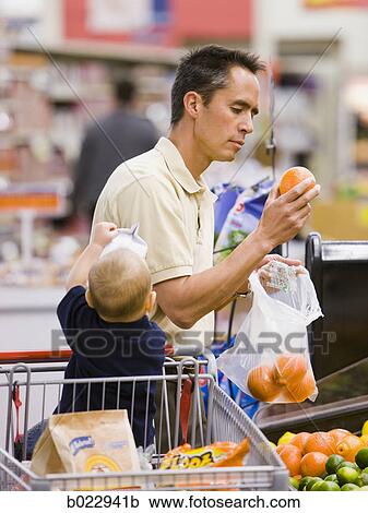 man grocery shopping with baby View Large Photo Image Stock Image - man grocery shopping with baby. Fotosearch