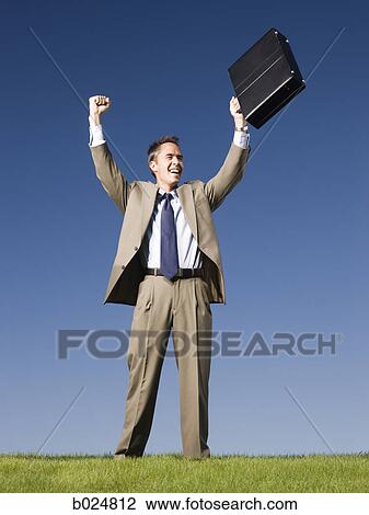 Stock Image - man holding a briefcase. Fotosearch