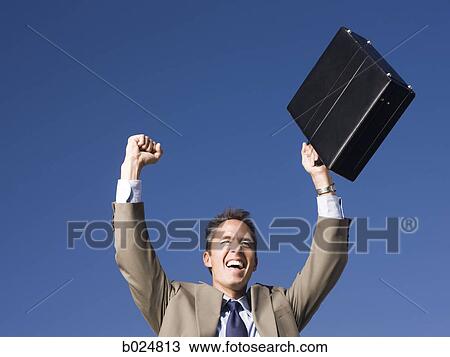 man holding a briefcase View Large Photo Image Stock Image - man holding a briefcase. Fotosearch