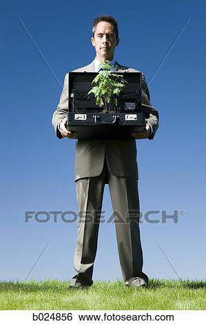 Stock Photograph - man holding a briefcase. Fotosearch
