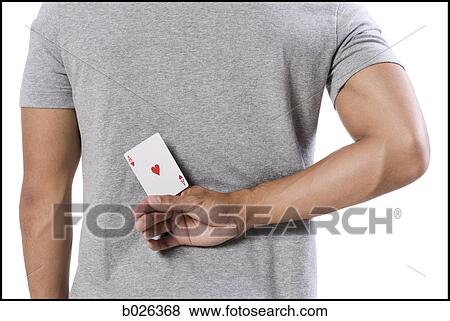 man holding an ace card behind his back View Large Photo Image Stock Photo - man holding an ace card behind his back. Fotosearch