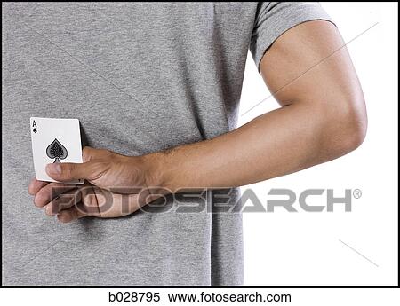 man holding an ace of spades behind his back View Large Photo Image Stock Photography - man holding an ace of spades behind his back. Fotosearch
