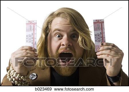 Stock Photo - man holding tickets. Fotosearch