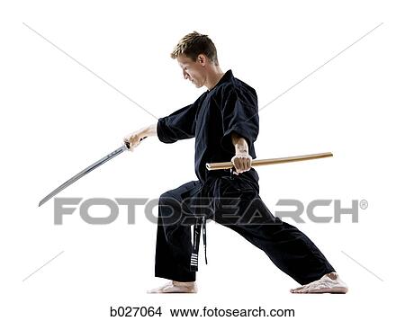 man in a black karate gi practicing martial arts View Large Photo Image Picture - man in a black karate gi practicing martial arts. Fotosearch