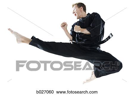 man in a black karate gi practicing martial arts View Large Photo Image Stock Image - man in a black karate gi practicing martial arts. Fotosearch