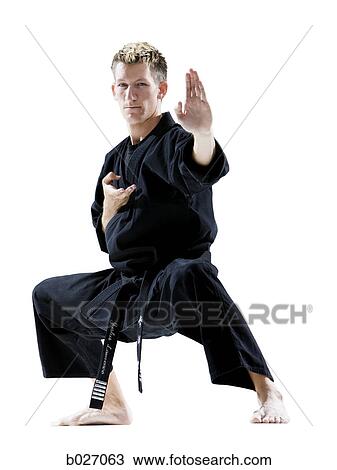 man in a black karate gi practicing martial arts View Large Photo Image Stock Image - man in a black karate gi practicing martial arts. Fotosearch