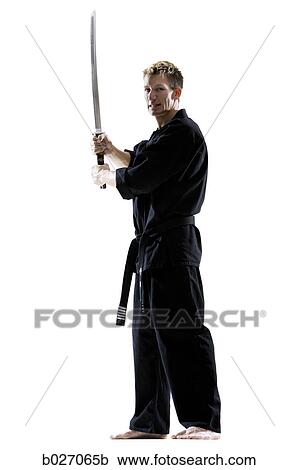 man in a black karate gi practicing martial arts View Large Photo Image Stock Image - man in a black karate gi practicing martial arts. Fotosearch