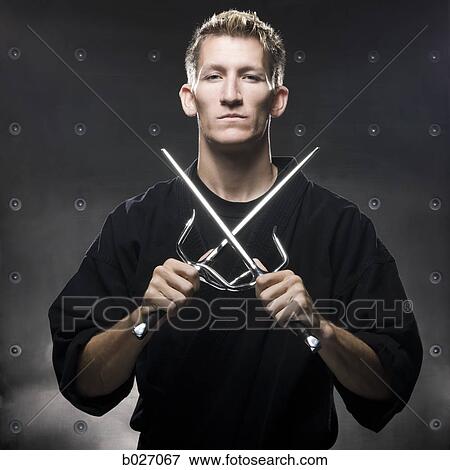 man in a black karate gi practicing martial arts View Large Photo Image Stock Photo - man in a black karate gi practicing martial arts. Fotosearch