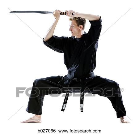 man in a black karate gi practicing martial arts View Large Photo Image Stock Photograph - man in a black karate gi practicing martial arts. Fotosearch