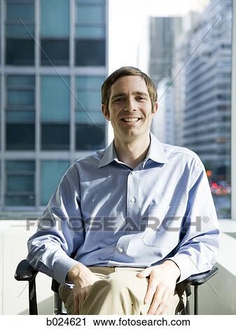 man in a blue shirt at work View Large Photo Image Stock Image - man in a blue shirt at work. Fotosearch