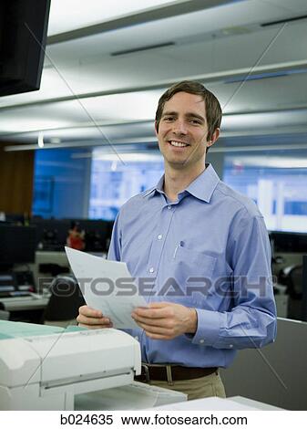 man in a blue shirt at work View Large Photo Image Stock Photography - man in a blue shirt at work. Fotosearch